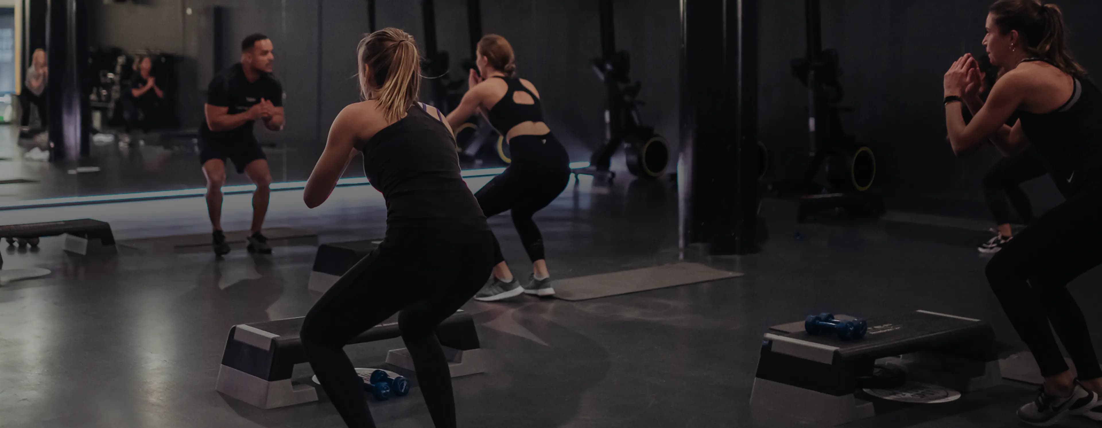 Corporate fitness workout class with instructor at Clubspportive.